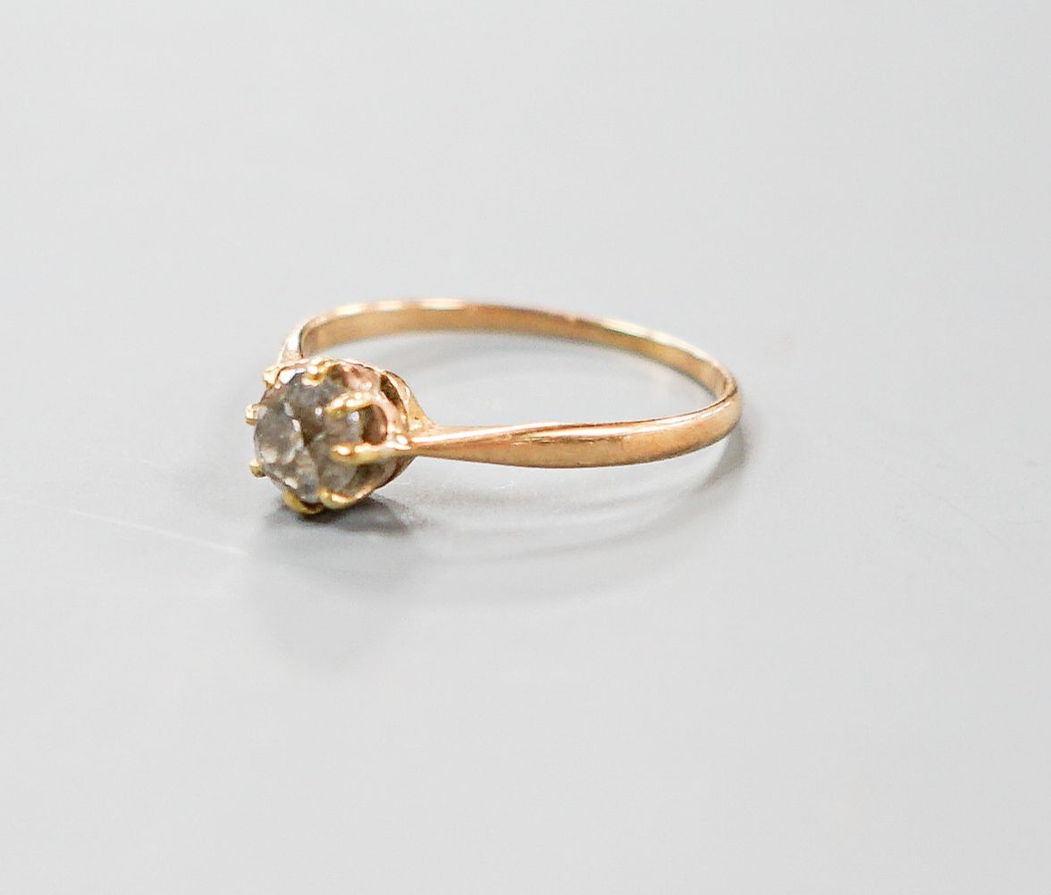 A George V 18ct gold and claw set solitaire diamond ring, size N/O, gross 1.6 grams.